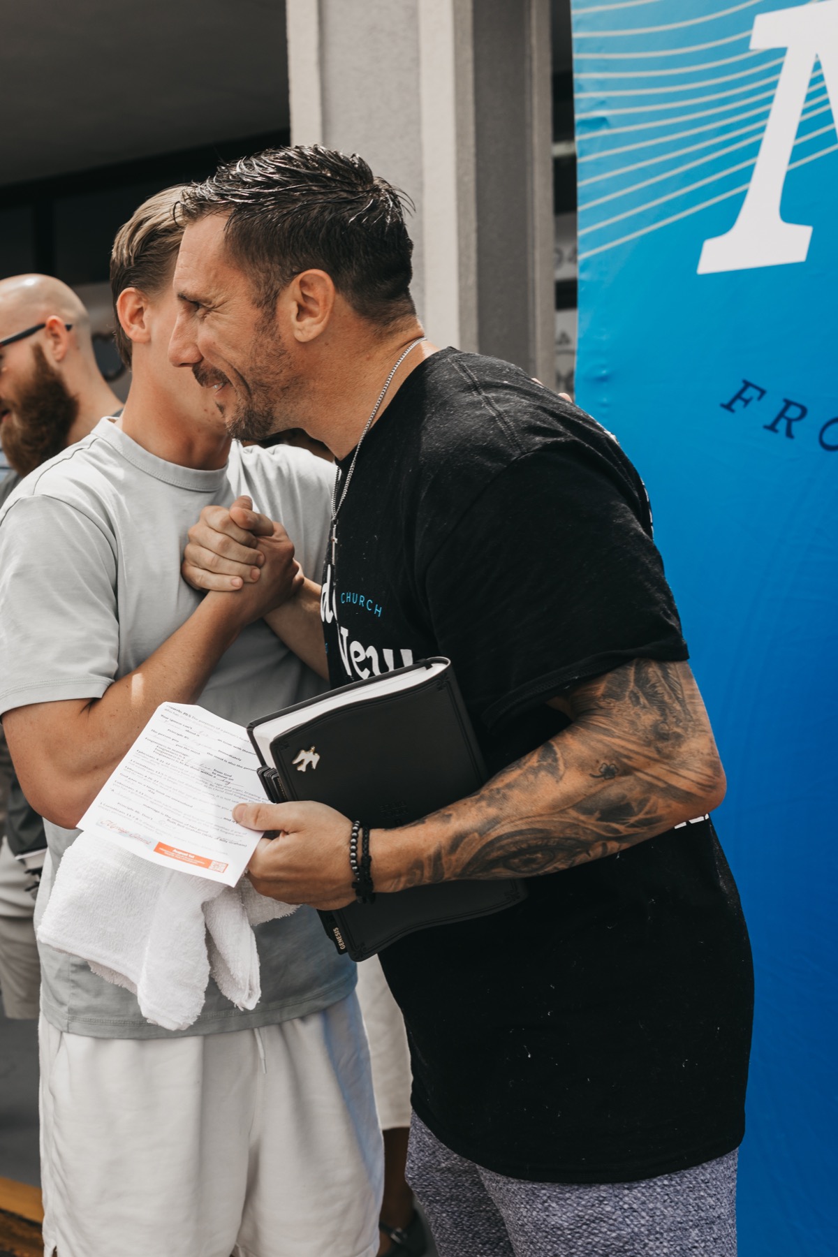 A baptism participant looks upward after being baptized.
